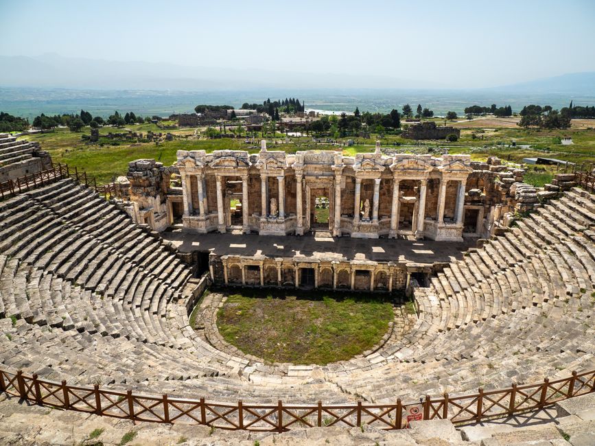 Explore the ancient grandeur of Hierapolis's Roman theater in Pamukkale, Türkiye, amidst stunning landscapes.